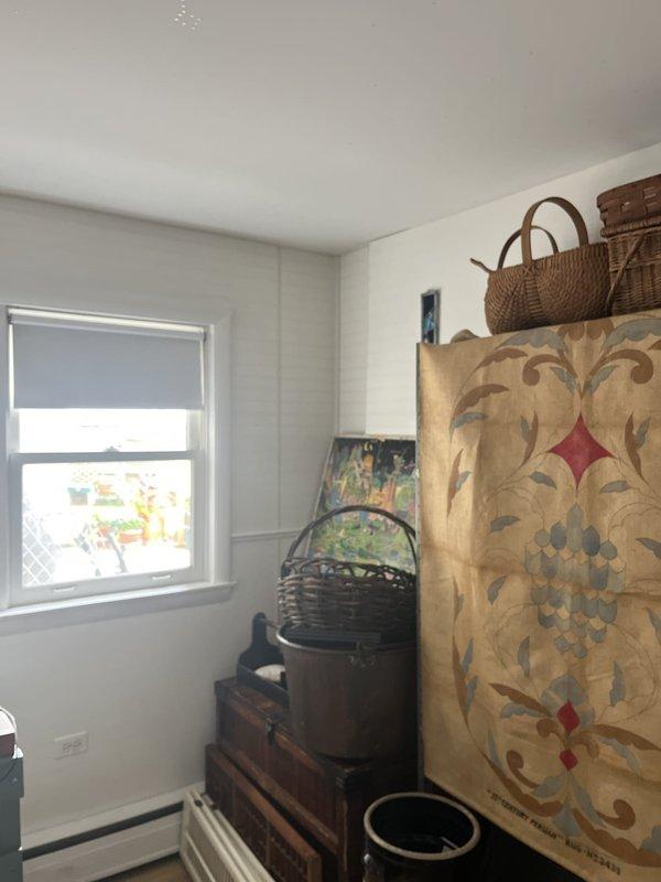 Conducted on-site evaluation for ductless mini split system installation in an upper-floor living space with no existing cooling equipment. Assessed room layout, electrical requirements, and optimal placement locations for indoor air handler and outdoor condensing unit to provide efficient climate control for the sloped-ceiling area.