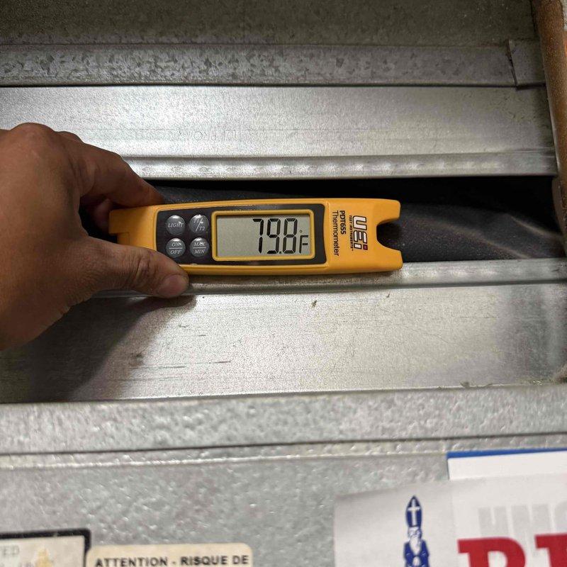 Responded to callback for air conditioning unit producing loud rattling noises described as "bowling balls" inside the system. Accessed electrical compartment and inspected capacitors, wiring connections, and internal components while performing diagnostic testing with field meter. Measured supply air temperature at 79°F and evaluated system operation. Addressed customer concerns following previous service visit and completed thorough inspection of outdoor unit to identify source of mechanical noise and ensure proper system function.