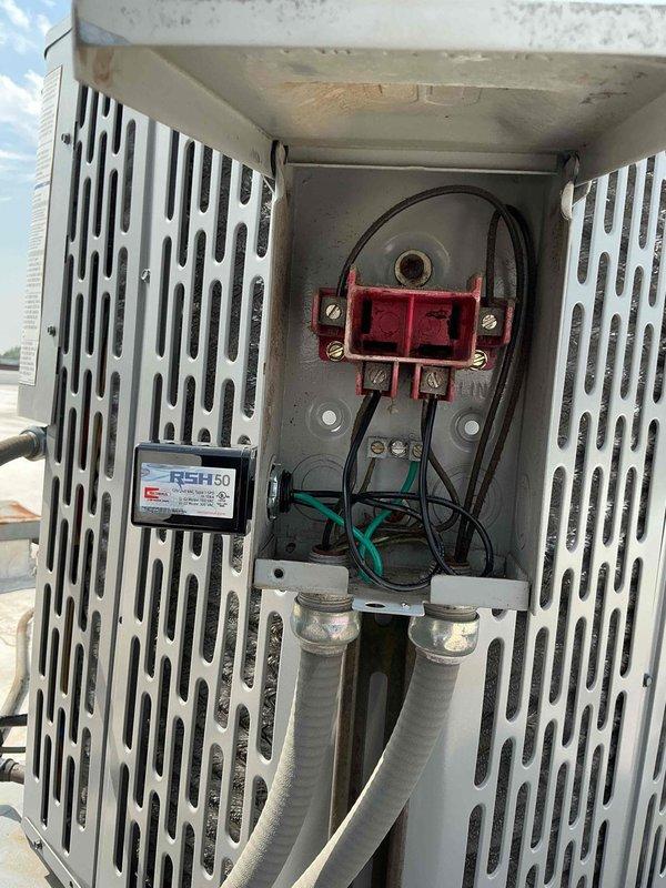 Completed installation of surge protector on outdoor HVAC unit's electrical compartment. Verified proper electrical connections to contactor assembly and confirmed unit protection against voltage spikes and power surges.