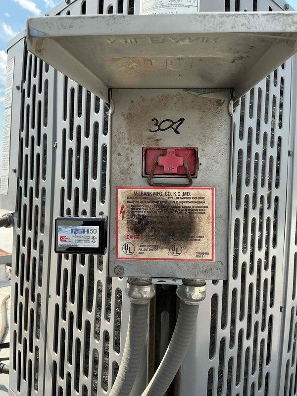 Completed installation of surge protector on outdoor HVAC unit's electrical compartment. Verified proper electrical connections to contactor assembly and confirmed unit protection against voltage spikes and power surges.
