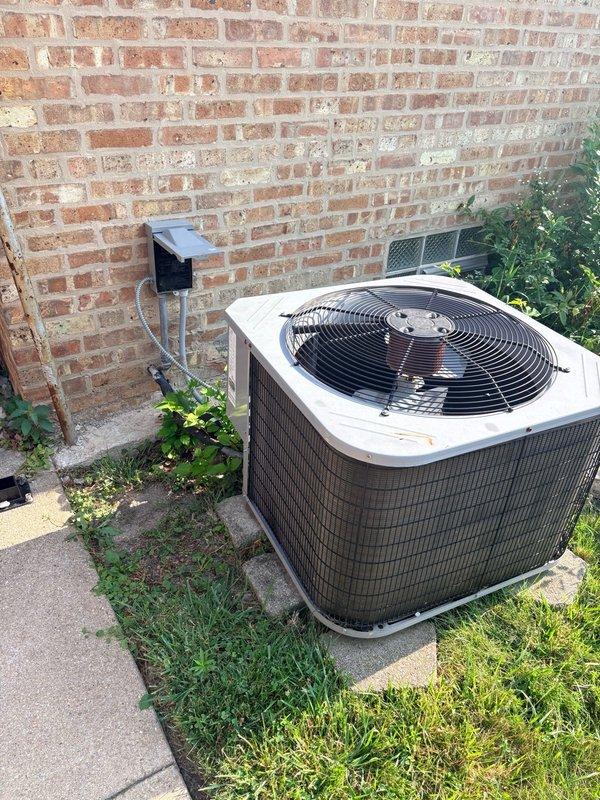 Responded to no cooling call for new customer. Performed diagnostic testing on outdoor condensing unit and identified failed dual-run capacitor (TRCFD5075, 50+7.5 MFD). Verified capacitor failure using digital multimeter, which showed significantly degraded capacitance reading of 7.48 microfarads. Replaced defective TITAN PRO motor run capacitor with new unit rated at 440/370VAC. Tested system operation, confirmed proper compressor and condenser fan motor function. Recorded all equipment information and discussed preventative maintenance options with customer. System restored to normal cooling operation.