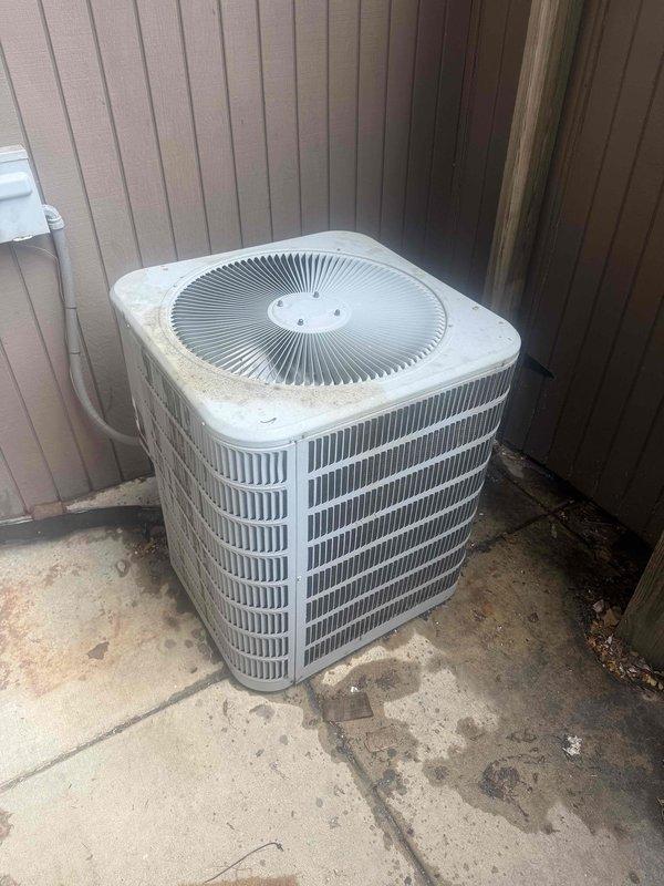 Responded to no cooling call at commercial facility. Upon arrival, found outdoor condenser unit operational but system not providing adequate cooling. Measured supply air temperature at 56.4°F, indicating insufficient cooling capacity. Inspected condenser unit exterior, noting debris accumulation around base and coil surfaces requiring cleaning. Assessed refrigerant charge and system performance. Collected payment for service call and diagnostic work, with additional repairs and labor to be billed separately.