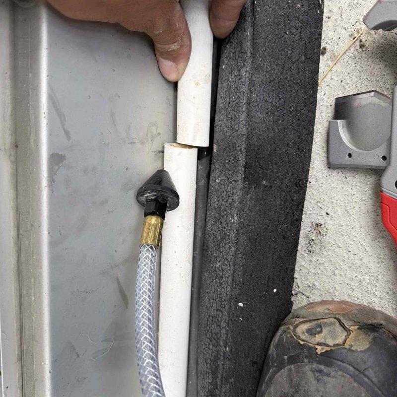 Responded to service call for wall-mounted mini-split air handler leaking water onto occupants below. Upon inspection, removed front access panel and found evaporator coil with excessive moisture accumulation and debris buildup on fins. Identified condensate drainage issue causing water to drip from unit instead of properly evacuating through drain line. Inspected condensate drain system including PVC drain line and confirmed blockage preventing proper drainage. Cleared obstruction from condensate line, cleaned evaporator coil assembly, and verified proper water flow through drainage system. Tested unit operation and confirmed condensate now draining correctly with no further leakage into living space.