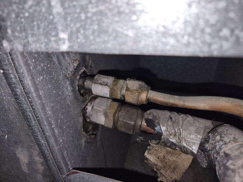 Responded to no cooling call where indoor fan was operating but system was blowing warm air. Verified thermostat settings, checked filter condition, and confirmed electrical breakers were in proper position. Inspected refrigerant line connections and system components, documenting equipment information and current operating conditions for diagnostic evaluation.