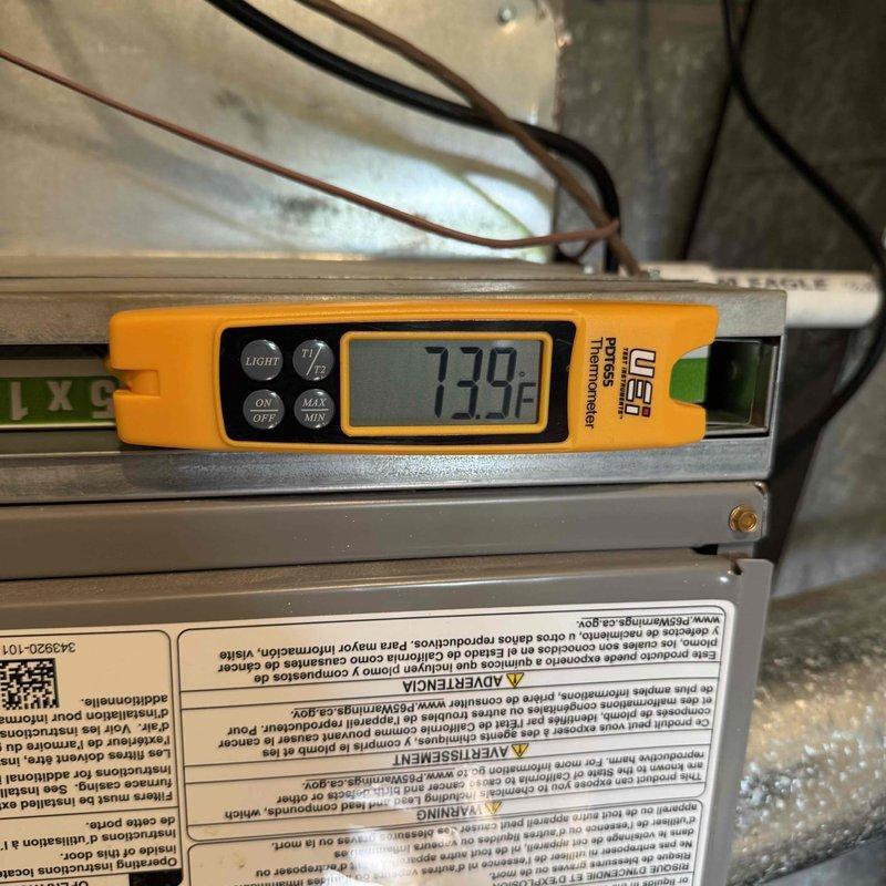 Responded to service call for cooling complaint on residential air conditioning system. Performed diagnostic evaluation and measured air side performance using digital instrumentation. Return air readings showed 72.9°F dry bulb temperature with 50.7% relative humidity, while supply air measured 58.4°F dry bulb with 70.5% relative humidity. System achieved 14.5°F temperature differential across the evaporator coil, indicating adequate cooling performance within normal operating parameters. Documented equipment information and captured diagnostic measurements for service records.