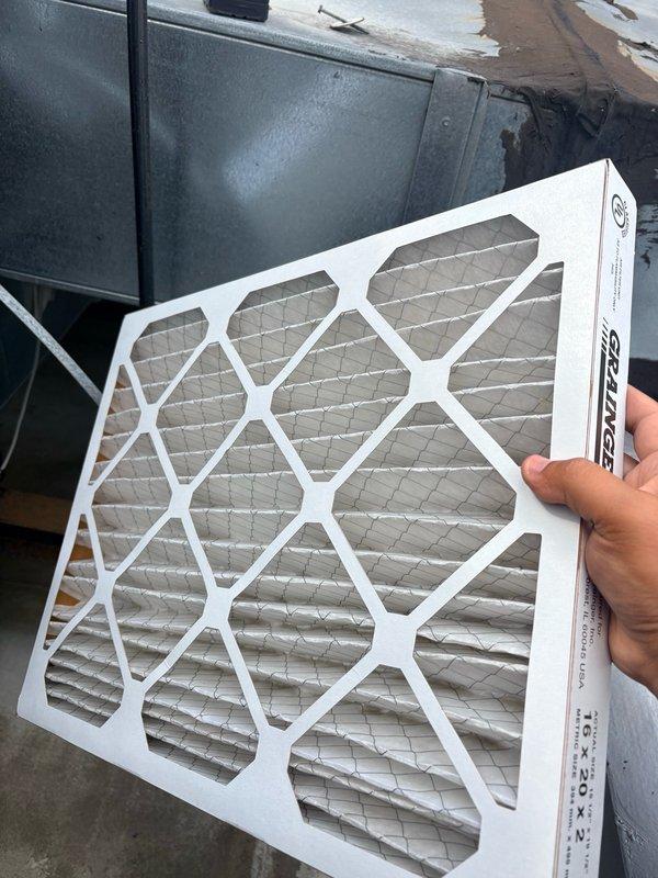 Completed summer preventive maintenance and clean and check on one HVAC system per Comfort Plan agreement. Performed comprehensive inspection of outdoor unit, replaced air filter, and verified proper system operation. Tested unit functionality at thermostat inside building, confirming cooling cycle engaged properly with system set to 75°F and maintaining 76°F ambient temperature at time of testing. All components operating within normal parameters upon departure.