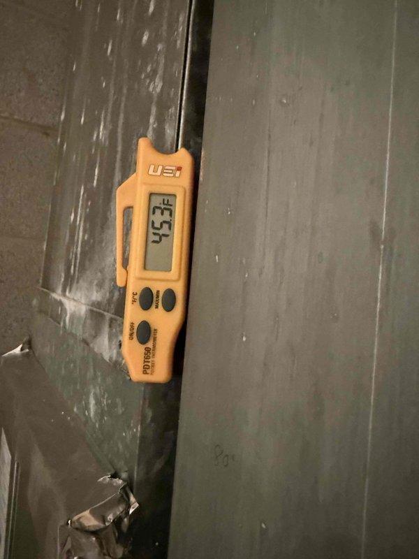 Responded to commercial air conditioning service call for warm air discharge and water leakage. Upon inspection, measured supply air temperature at 45.4°F, indicating inadequate cooling performance. Documented drainage issue with visible water accumulation on floor requiring placement of absorbent material. Identified concerns with condensate management system. Performed diagnostic evaluation of refrigerant circuit and airflow components as part of prepaid maintenance agreement. Captured thermal readings and documented equipment conditions for service records.