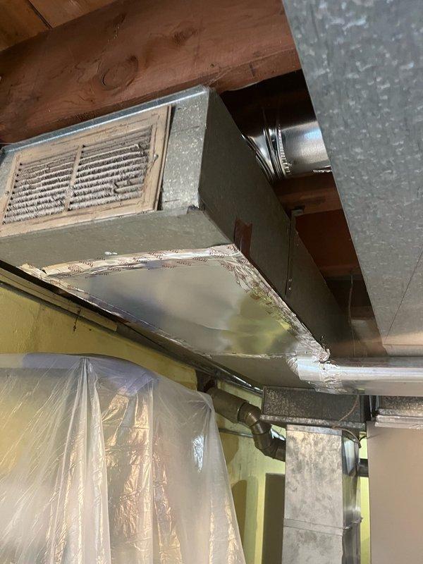 Installed four new 6-inch supply air branch runs in the basement ceiling and connected them to the existing supply trunk line. Installed two new 7-inch return air branch runs low on the basement wall and connected them to the existing return trunk line. Mounted four new supply registers and two new return grilles at designated locations. Removed abandoned 1/4-inch copper line and humidifier solenoid valve, then capped the existing piercing valve to complete the ductwork modifications.