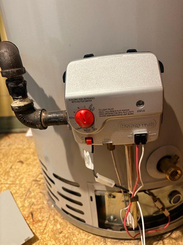 Responded to service call for reported water heater leak. Upon inspection, assessed existing tanked water heater unit installed in utility closet with standard venting and copper piping connections. Examined Honeywell gas control valve assembly, temperature controls, and pilot system for proper operation. Evaluated all plumbing connections, supply lines, and discharge piping for signs of moisture or active leaking. Inspected venting system including flexible ductwork and exhaust configuration. Verified proper installation of pressure relief valve and associated discharge tube. Documented equipment condition with detailed photographs showing water heater positioning, control components, and connection points. Discussed comfort plan renewal options and preventative maintenance services including air conditioning system evaluation.