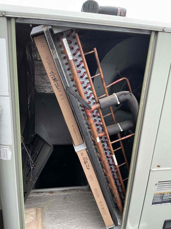 Completed summer preventive maintenance filter change on commercial HVAC system per agreement specifications. Replaced filters on RTU#1 with two 20x20x2 filters and four 20x25x2 filters, inspected BX70 belt. Replaced six 16x20x2 filters on RTU#2 and inspected BX42 belt. Changed one 20x25x1 filter on air handler located in basement storage room/south hallway. All units inspected, access panels secured, and systems left in proper operating condition.