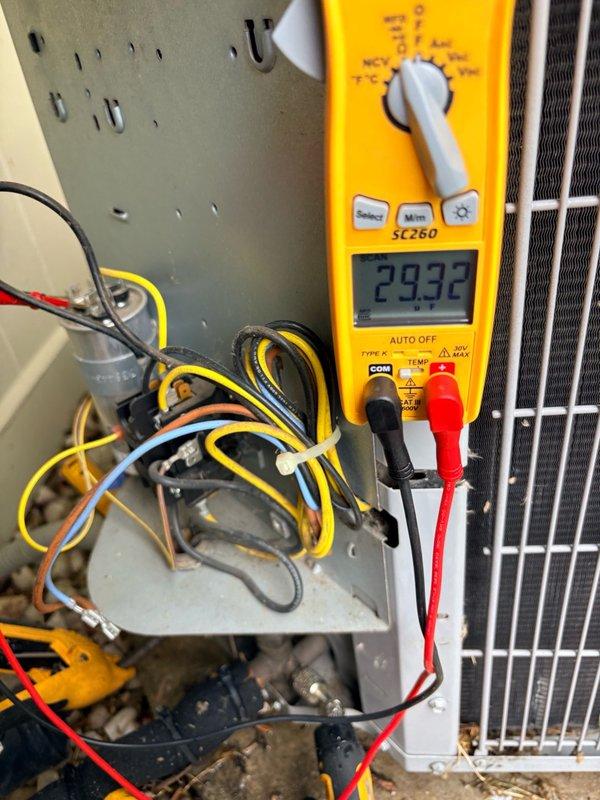 Completed comprehensive clean and check maintenance service on two air conditioning systems per comfort plan agreement. Performed electrical diagnostics including capacitor inspection and voltage testing, with multimeter readings confirming proper system operation at 293.2 volts, and verified all electrical connections and components are functioning within manufacturer specifications.