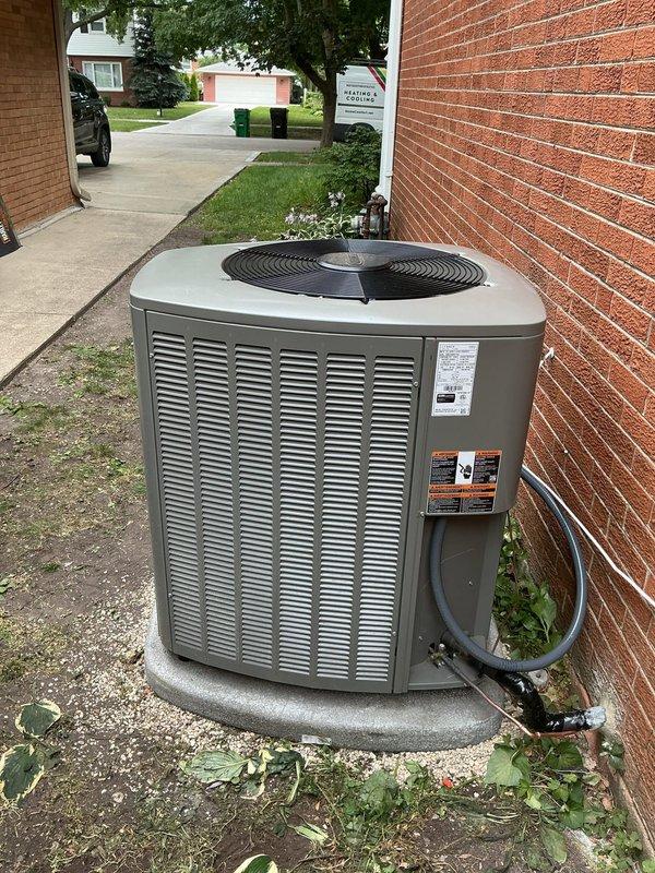 Relocated outdoor air conditioning unit approximately 3 feet to new position on right side of existing service disconnect. Installed new concrete pad with pea gravel base for proper equipment support and drainage. Created new penetration through brick wall and ran new refrigerant lineset through opening to connect relocated unit. Sealed penetration appropriately to prevent air and moisture infiltration. Connected refrigerant lines to unit and performed vacuum and pressure testing to verify system integrity. Tested unit for proper operation, confirming appropriate pressures with readings of 532.3 PSI on low side and 333.2 PSI on high side. Verified proper airflow, temperature differential, and overall system performance. Unit operating within manufacturer specifications upon completion.