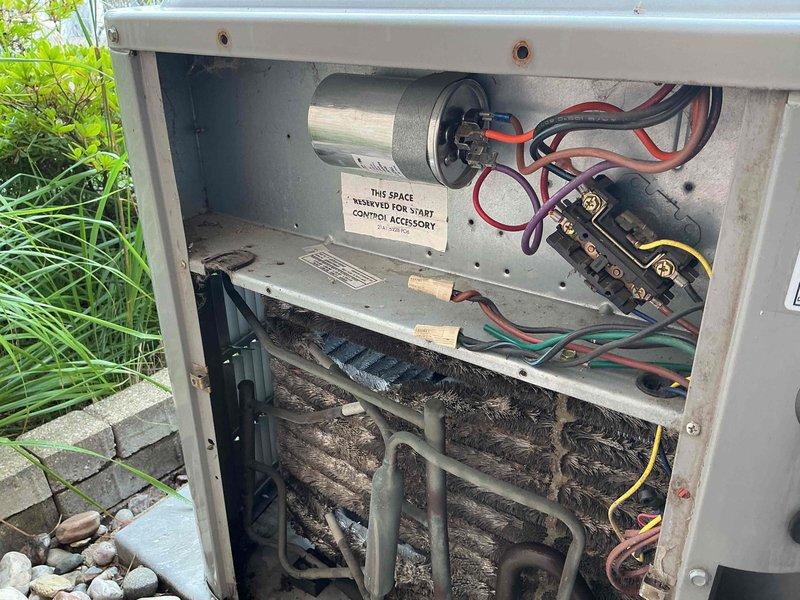 Completed Comfort Plan Clean and Check maintenance on a 24-year-old outdoor air conditioning unit. Performed comprehensive system inspection including electrical components, capacitor, contactor, and thermostat operation. Identified heavy dirt and debris accumulation on evaporator coils requiring attention. Verified Nest thermostat functionality with system set to cool at 72 degrees and operating properly. Collected payment for Comfort Plan renewal.