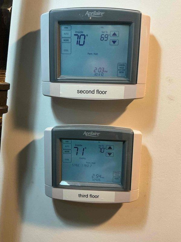 Responded to no cooling condition affecting second floor zone. Diagnosed failed wireless relay system preventing proper communication between thermostats and rooftop HVAC unit. Replaced all three wireless relays with hardwired relay configuration, installing new weatherproof junction boxes, transformers, and control relays to ensure reliable zone control. Verified proper operation of Aprilaire thermostats controlling second and third floor zones, confirmed cooling cycle engagement, and tested system communication with rooftop Lennox condensing unit. All zones now operating correctly with proper temperature control and scheduling functions restored.