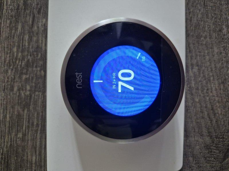 Responded to no cooling complaint on 2017 residential air conditioning system. Customer reported previous refrigerant additions and suspected low R410a charge. Upon arrival, verified thermostat settings on Nest unit showing cooling mode with setpoint at 70°F and current temperature reading of 85°F. Performed visual inspection of outdoor condensing unit and conducted standard diagnostic procedures to assess system performance and identify root cause of cooling deficiency.