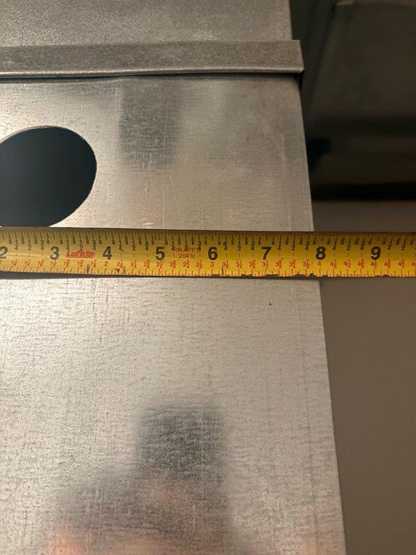 Conducted pre-installation site survey to assess HVAC system installation requirements. Documented and measured existing ductwork dimensions and clearances in attic space, including metal supply plenum and flexible duct connections. Measured metal surfaces and duct junction boxes to verify proper sizing for upcoming equipment installation, capturing detailed measurements ranging from 2-9 inches on metal components and 24-30 inches across ductwork sections to ensure accurate equipment fit and code compliance.