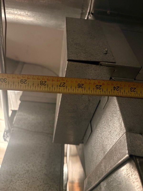 Conducted pre-installation site survey to assess HVAC system installation requirements. Documented and measured existing ductwork dimensions and clearances in attic space, including metal supply plenum and flexible duct connections. Measured metal surfaces and duct junction boxes to verify proper sizing for upcoming equipment installation, capturing detailed measurements ranging from 2-9 inches on metal components and 24-30 inches across ductwork sections to ensure accurate equipment fit and code compliance.