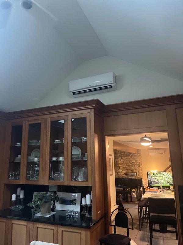 Conducted on-site assessment for replacement of existing mini-split system consisting of five total units. Current equipment includes aging LG inverter outdoor condenser with associated refrigerant lines and indoor wall-mounted air handler in kitchen area. Both units remain operational but are showing age. Documented existing installation configuration including outdoor unit placement on concrete pad with refrigerant accumulator, copper and aluminum line sets with insulation, and indoor evaporator mounted above cabinetry near vaulted ceiling. Customer expressed preference for Mitsubishi equipment for complete system replacement. Provided estimate for removal of existing units and installation of new Mitsubishi mini-split system.