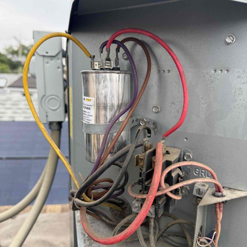 Responded to no-cooling call for rooftop Goodrich AC unit. Upon inspection, found failed dual-run capacitor preventing compressor and condenser fan operation. Replaced defective capacitor with properly rated unit, restored power, and verified system operation with normal amperage draw and temperature split. Documented equipment information, discussed preventative maintenance options with customer, and system returned to full cooling capacity.