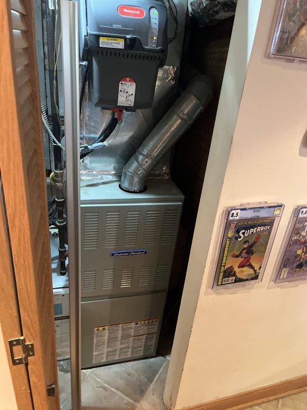 Responded to service call for air conditioning system blowing warm air after customer observed frozen evaporator coil the previous night. Evaluated existing American Standard furnace and air handler installation in utility closet. After comprehensive system assessment and discussion of repair options, provided estimate for complete HVAC system replacement including new equipment installation, proper refrigerant line connections, and ductwork integration. Also assessed water heater B-vent configuration as requested to ensure proper venting compliance.