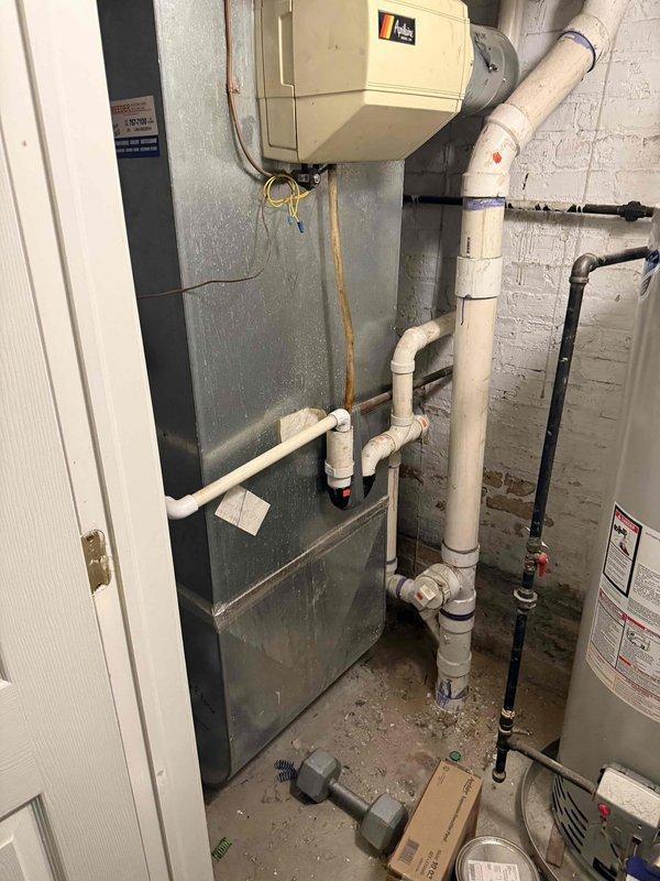 Responded to new customer service call for humidifier operation and functionality assessment. Upon arrival, located Aprilaire humidifier unit installed in basement mechanical room adjacent to air handler system. Observed significant condensation accumulation on ductwork above humidifier, indicating potential over-humidification or control issues. Inspected humidifier control humidistat mounted near unit and assessed operational status. Provided customer education on proper humidistat operation, including seasonal adjustment settings and humidity level recommendations for optimal indoor air quality and equipment performance. Documented existing equipment with photographs showing humidifier installation, ductwork configuration, and mechanical room layout. Discussed repair versus replacement options for humidifier system based on current condition and performance concerns. Noted condensation issues require monitoring and potential humidistat recalibration or replacement to prevent moistur