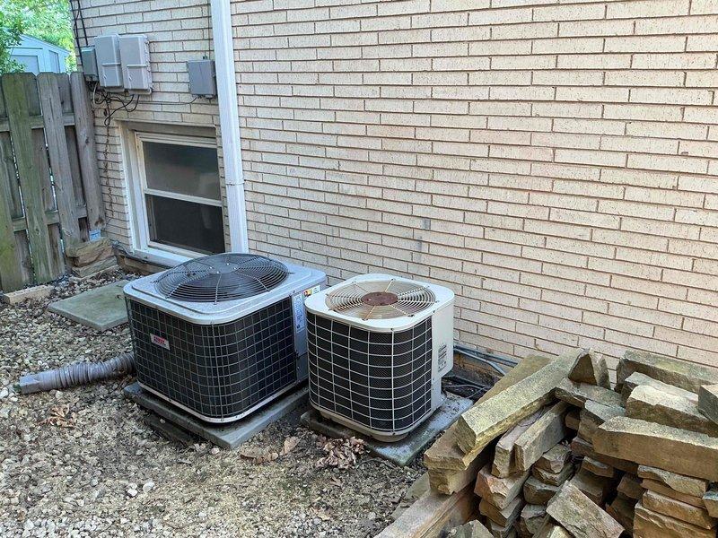 Completed comprehensive clean and check maintenance service on two air conditioning systems and two air handler units per the Gold Comfort Plan agreement. Performed thorough inspection of both outdoor condensing units located on exterior gravel pad, including cleaning of condenser coils, checking refrigerant levels, testing capacitors, and verifying proper electrical connections and amp draw on compressors. Inspected indoor air handler equipment in basement utility area, checking blower motor operation, replacing air filters, examining evaporator coil condition, and verifying proper drainage from condensate lines. Noted significant rust and corrosion present on refrigerant line sets and mechanical components in basement area, which appears age-related from moisture exposure over time. All systems tested and confirmed operational with acceptable temperature differentials across coils. Both units cycling properly with no immediate service needs identified beyond routine maintenance perfo