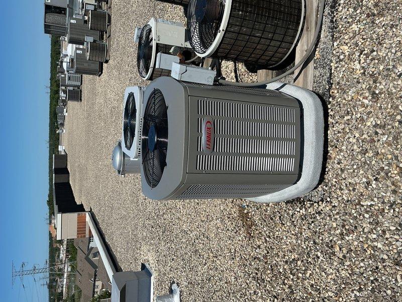 Disconnected and properly disposed of existing air handler with hydronic coil from mechanical closet and removed existing A/C condenser per EPA guidelines. Installed new ASPEN 2.5-3.0 ton air handler with hydronic coil in mechanical closet, fabricating necessary sheet metal transitions to connect to existing supply air ductwork, return air ductwork, and electrical service. Installed new Lennox 15 SEER2 EL15KC1-024-230 2.5 ton condensing unit on rooftop in same location as previous unit. Provided and installed new Honeywell T4 thermostat for system control. Completed startup procedures, performed system testing with digital instrumentation to verify proper operation, and made all final adjustments to ensure optimal performance.
