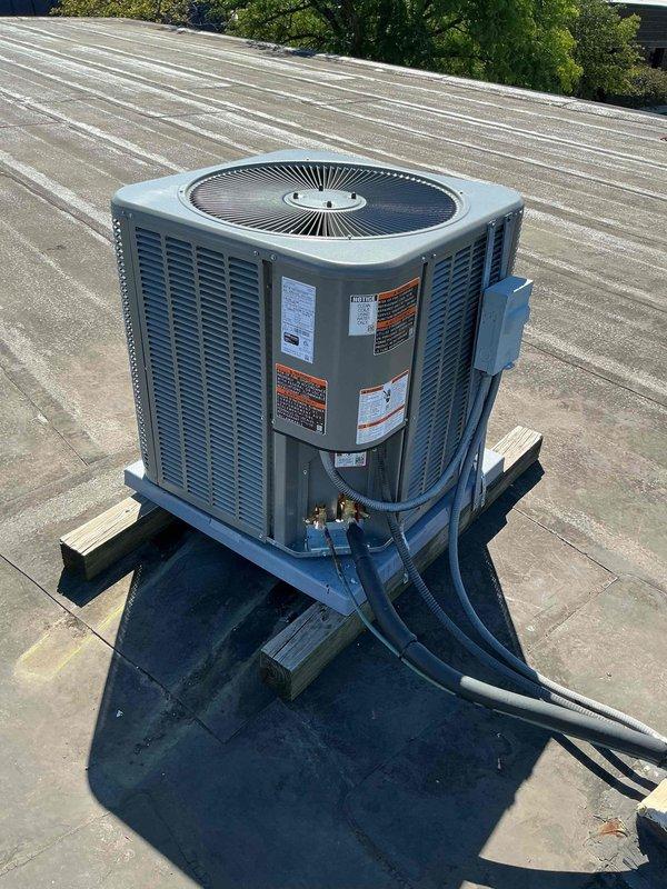 Completed installation of 2.5 ton air conditioning system with matching evaporator coil on commercial flat rooftop to work in conjunction with existing Lennox furnace. Unit was mounted on appropriate equipment pad with proper leveling, refrigerant lines were insulated and routed professionally, and all electrical connections were completed per manufacturer specifications and local code requirements.