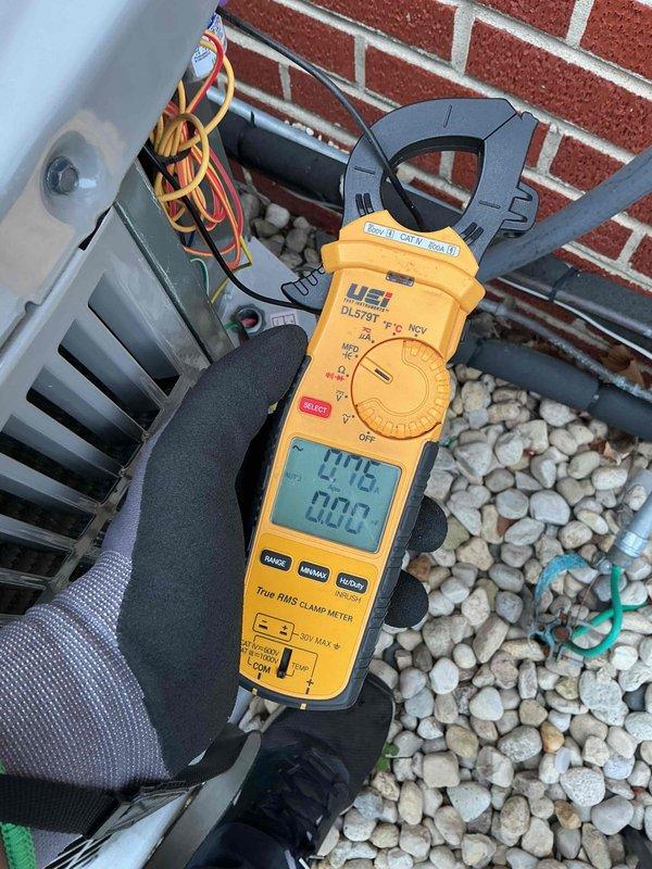 Completed Comfort Plan clean and check service on two air conditioning systems. Performed electrical diagnostics with clamp meter showing 77.7 amp draw, measured supply air temperature at 56.6°F at register, and collected payment for annual Comfort Plan renewal.