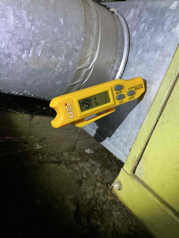 Performed comprehensive tune-up and diagnostic service on dual-system HVAC installation for recently purchased residence. Accessed air handler unit located in attic crawl space, replaced air filters, and completed full system inspection including ductwork and insulation integrity. Diagnosed non-operational outdoor condensing unit and verified primary system maintaining adequate cooling capacity for entire home, with supply air temperature reading 99.1°F documented at main trunk line.