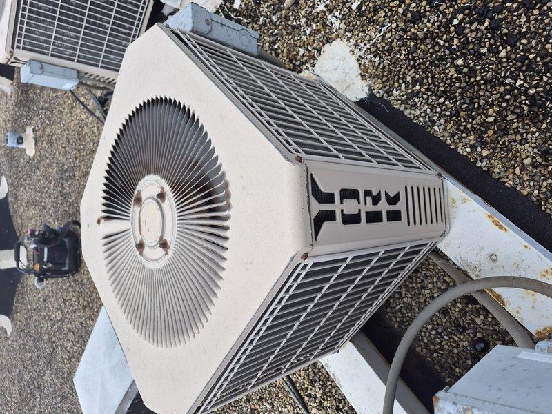 Completed routine maintenance and tune-up on rooftop-mounted air conditioning unit. Accessed equipment via roof, inspected condenser unit including fan assembly and protective grilles, verified all components operational and secure. Unit found in good working condition with all safety features and access panels properly secured with locking mechanisms intact.