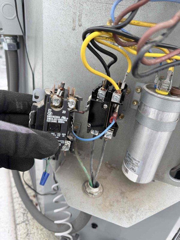 Responded to callback for air conditioning system not cooling after previous service visit. Upon arrival, verified indoor temperature remained elevated at 78 degrees with no improvement over four-hour period. Inspected outdoor unit electrical connections and contactor assembly where previous shorted thermostat wire repair was completed. Identified burn mark at thermostat wire terminal on outdoor unit consistent with prior diagnosis. Replaced damaged low-voltage control wiring between outdoor condensing unit and indoor air handler. Verified all electrical connections at contactor, capacitor, and terminal blocks were secure and properly torqued. Tested system operation through complete cooling cycle, confirmed contactor engagement, compressor startup, and proper airflow from indoor unit. System now cooling effectively with thermostat responding correctly to temperature calls.