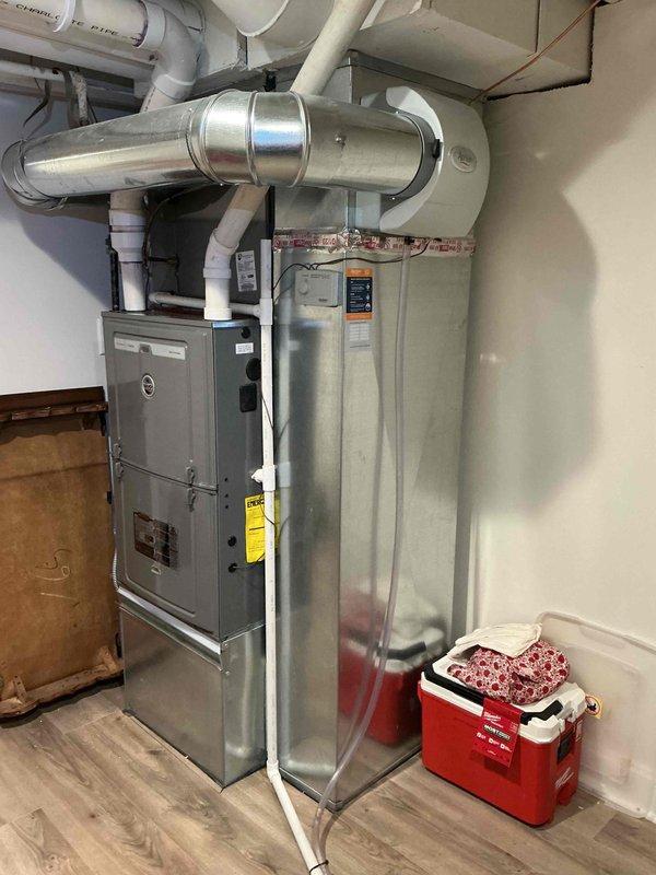 Responded to service call for reported water leak through HVAC system. Upon arrival, performed visual inspection of furnace unit and surrounding equipment in utility room. Examined electrical control panel, capacitor, contactors, and wiring connections for signs of moisture intrusion or condensate issues. Inspected PVC condensate drain lines, ductwork, and ventilation components for potential leak sources. Documented equipment condition and configuration with photographs for service records. Collected standard dispatch fee and discussed available flat rate repair options with property owner, along with new customer discounts and comfort plan enrollment opportunities. All equipment information entered into system per protocol.