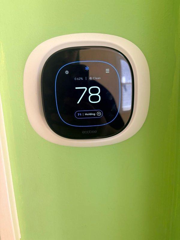 Responded to customer report of recurring leak following initial warranty visit. Performed comprehensive leak detection using electronic sniffer and bubble solution on all refrigerant connections and evaporator coil. Inspected water heater installation, PVC condensate drain lines, and all associated plumbing connections. Verified ecobee thermostat operation and system performance at 78°F setpoint. System monitored under operating conditions with customer advised to report if leaking reoccurs, at which point ceiling access will be required to identify source and determine warranty coverage.
