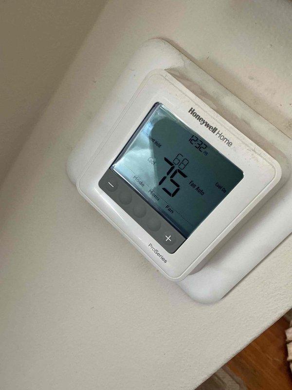 Responded to callback for recurring frozen evaporator coil and no cooling. Found intermittent blower motor operation caused by loose wire connections at furnace; secured all wiring connections and verified consistent blower operation. Checked refrigerant charge at outdoor unit and found low system pressures contributing to coil freezing. Added approximately 2 lbs of refrigerant with leak sealant to restore proper operating pressures. Verified thermostat operation and system performance. All parameters operating within normal range at time of departure.