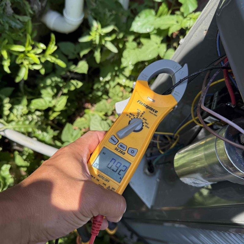 Completed annual cooling system tune-up and maintenance on a 9-year-old air conditioning system. Performed comprehensive inspection of indoor air handler unit in basement, checked all electrical connections and measured amperage draw at 9.2 amps on outdoor condensing unit, verified proper refrigerant levels, inspected condensate drainage system, and confirmed all components operating within manufacturer specifications.