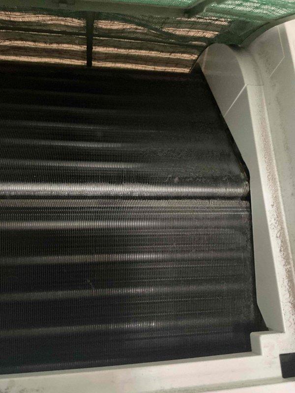 Responded to water leak complaint originating from HVAC unit on room side. Upon inspection, discovered significant dust and debris accumulation on evaporator coil fins and surrounding components. Documented conditions showing contaminated coil surfaces and potential drainage obstruction. Identified buildup as likely cause of condensate overflow leading to reported water leak. Photographed affected areas for service records.