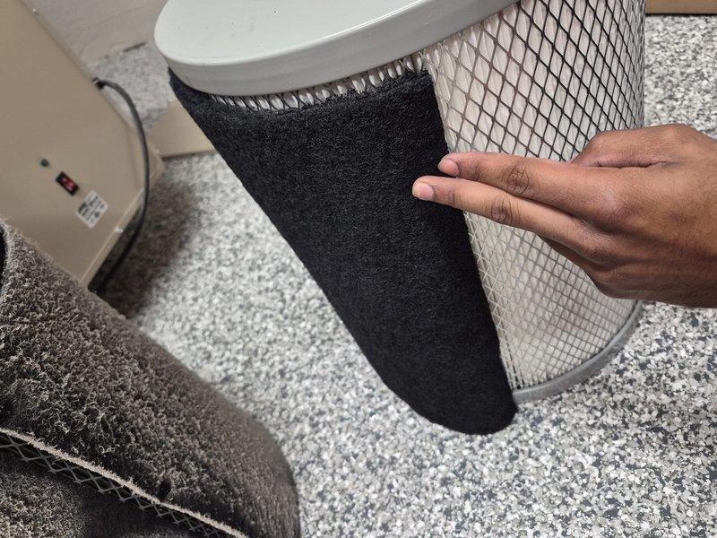 Completed replacement of HEPA filter and pre-filter on HVAC system. Removed old cylindrical filters and installed new units with proper mesh construction and white end caps, ensuring secure fit within the equipment housing. Collected final payment for outstanding invoice balance.