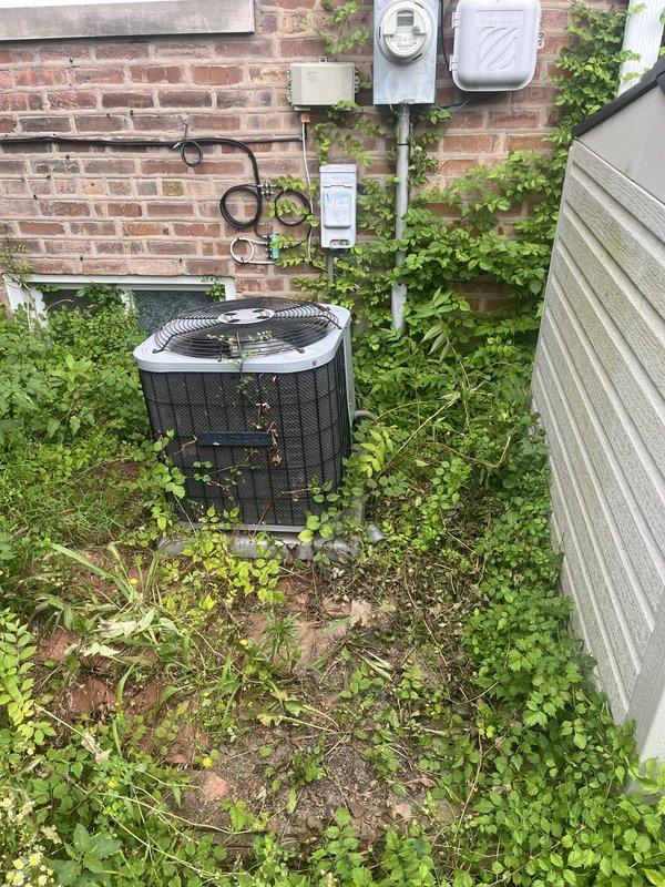 Responded to service call for 10-year-old R22 air conditioning system blowing warm air. Upon arrival, inspected American Standard furnace and outdoor condenser unit, noting significant vegetation overgrowth around condenser restricting airflow and potential refrigerant issues based on previous freezing incidents. Provided comprehensive estimate for complete HVAC system replacement including installation of a 2-zone ductless mini-split system to address current equipment age, obsolete R22 refrigerant, and ongoing performance concerns.