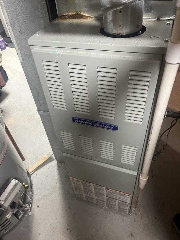 Responded to service call for 10-year-old R22 air conditioning system blowing warm air. Upon arrival, inspected American Standard furnace and outdoor condenser unit, noting significant vegetation overgrowth around condenser restricting airflow and potential refrigerant issues based on previous freezing incidents. Provided comprehensive estimate for complete HVAC system replacement including installation of a 2-zone ductless mini-split system to address current equipment age, obsolete R22 refrigerant, and ongoing performance concerns.