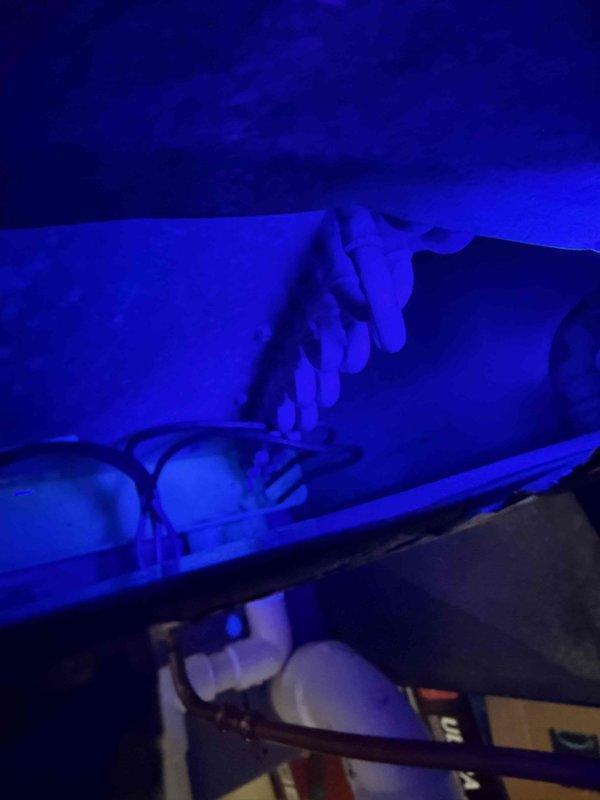 Performed comprehensive warranty leak inspection on HVAC system using electronic leak detector, bubble solution, and visual search methods. Utilized UV lighting to inspect evaporator coil, refrigerant lines, and filter drier connections throughout the air handler unit. No refrigerant leaks detected; system operating within normal parameters and warranty service completed successfully.