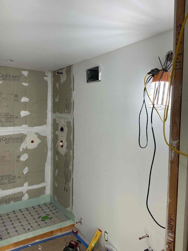 Completed installation of supply grills in commercial space and removed existing electric heat kit from system. Temporarily patched plenum opening to maintain system integrity and proper airflow until permanent modifications can be completed.