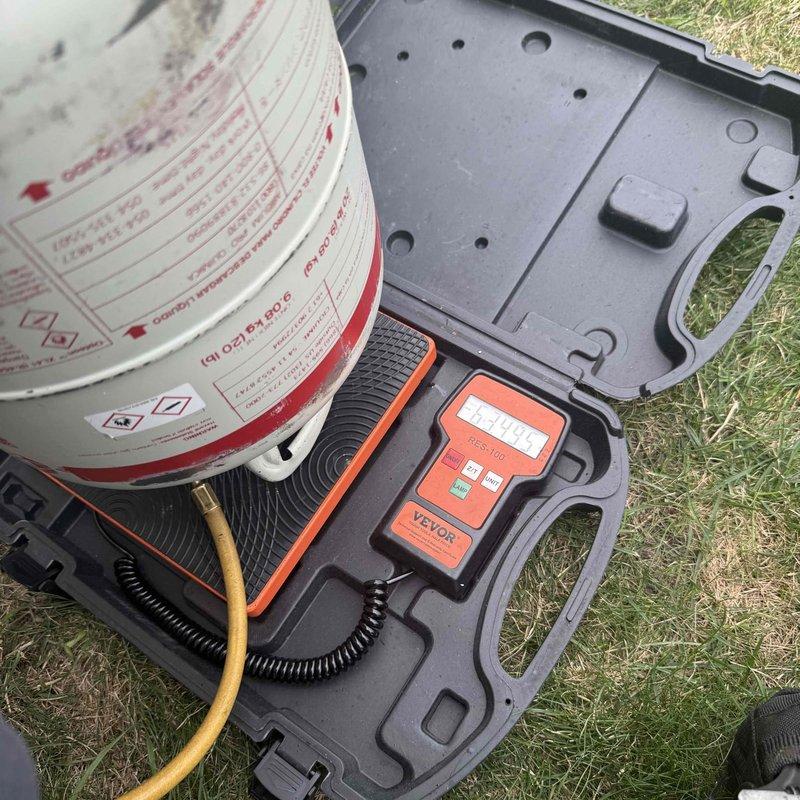 Diagnosed and repaired a refrigerant leak at the condenser unit by cutting out and replacing a failed 3/8" coupling. Trapped existing refrigerant into the compressor, performed vacuum test on the repaired lines to verify system integrity, and recharged the system with refrigerant weighed to manufacturer specifications.