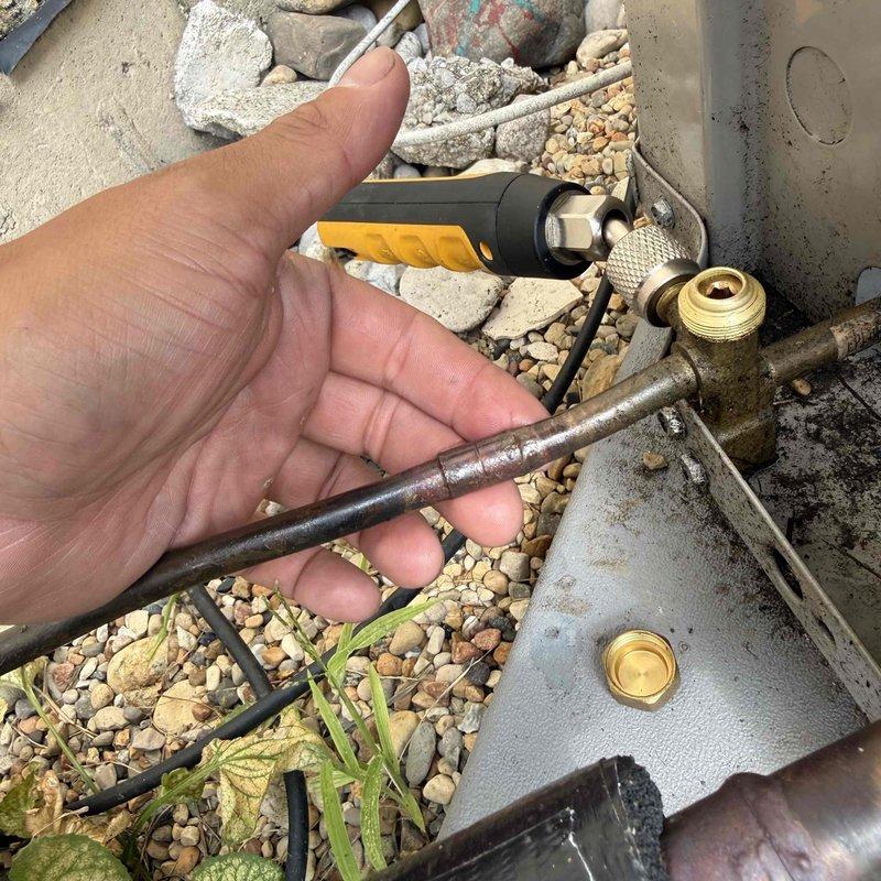Diagnosed and repaired a refrigerant leak at the condenser unit by cutting out and replacing a failed 3/8" coupling. Trapped existing refrigerant into the compressor, performed vacuum test on the repaired lines to verify system integrity, and recharged the system with refrigerant weighed to manufacturer specifications.