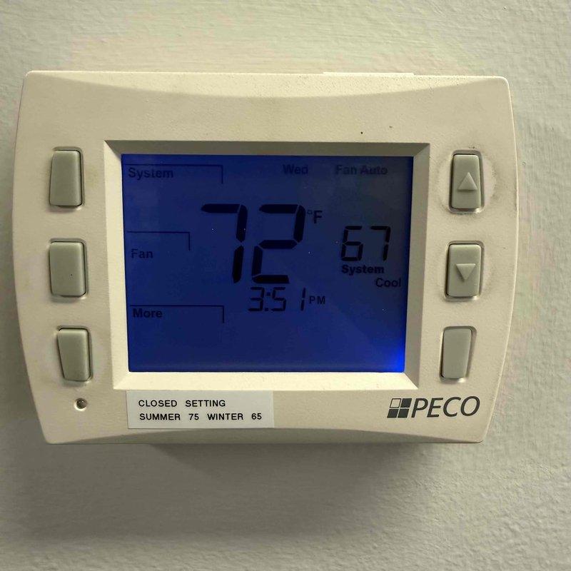 Responded to no cooling complaint for Suite 31. Upon arrival, found unit producing minimal cooling output. Inspected thermostat showing 72°F setpoint with system in cooling mode, then examined control board assembly and wiring connections. Documented system conditions including thermostat display readings and internal control board configuration for diagnostic purposes.