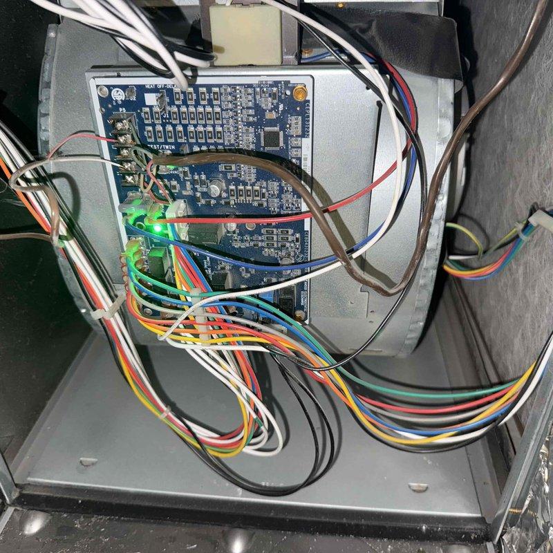 Responded to no cooling complaint for Suite 31. Upon arrival, found unit producing minimal cooling output. Inspected thermostat showing 72°F setpoint with system in cooling mode, then examined control board assembly and wiring connections. Documented system conditions including thermostat display readings and internal control board configuration for diagnostic purposes.