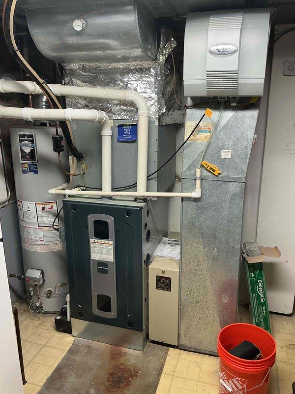 Completed spring seasonal clean and check maintenance on single HVAC system per comfort plan agreement. Performed comprehensive inspection of outdoor condensing unit and indoor furnace system, verified proper operation of all components including Aprilaire humidifier, checked refrigerant lines and electrical connections, and documented equipment condition with photos. Collected comfort plan renewal payment to cover fall 2026 and spring 2027 service visits.