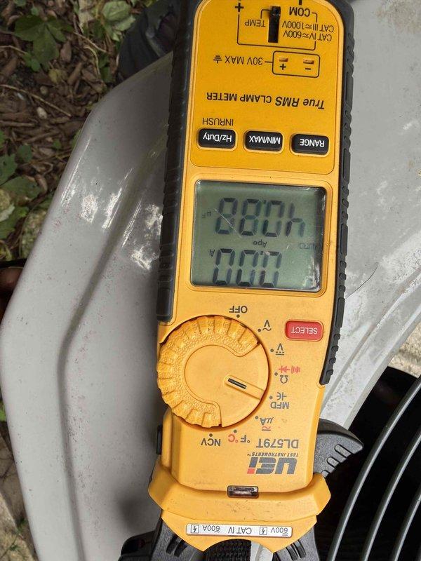 Completed Gold Clean and Check for Cooling on residential HVAC system. Performed comprehensive spring maintenance inspection including electrical testing with True RMS clamp meter, verified system operation, inspected furnace and air handler components, checked refrigerant lines and ductwork connections, and documented equipment condition with baseline readings showing 0.02 measurement on multimeter. All components operating within normal parameters with no deficiencies noted at time of service.