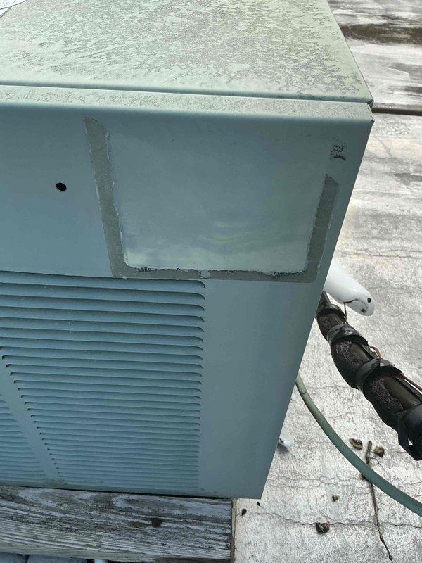 Responded to no cooling complaint on 10+ year old rooftop HVAC system. Upon arrival, tenant reported frozen evaporator coil with supporting photos. Inspected indoor furnace unit and found blower motor producing screeching noise while maintaining proper airflow and RPM. Attempted to access rooftop condenser unit for complete system diagnosis but required building management authorization for roof access. Photographed accessible rooftop equipment showing weathered condenser unit with exposed compressor, refrigerant lines, electrical junction box, and condenser coils exhibiting signs of age and outdoor exposure. Unable to complete full system evaluation or perform refrigerant charge testing due to access restrictions. Recommended return visit once roof access is approved to diagnose root cause of frozen coil condition, inspect condenser operation, check refrigerant levels, and address blower motor noise issue.