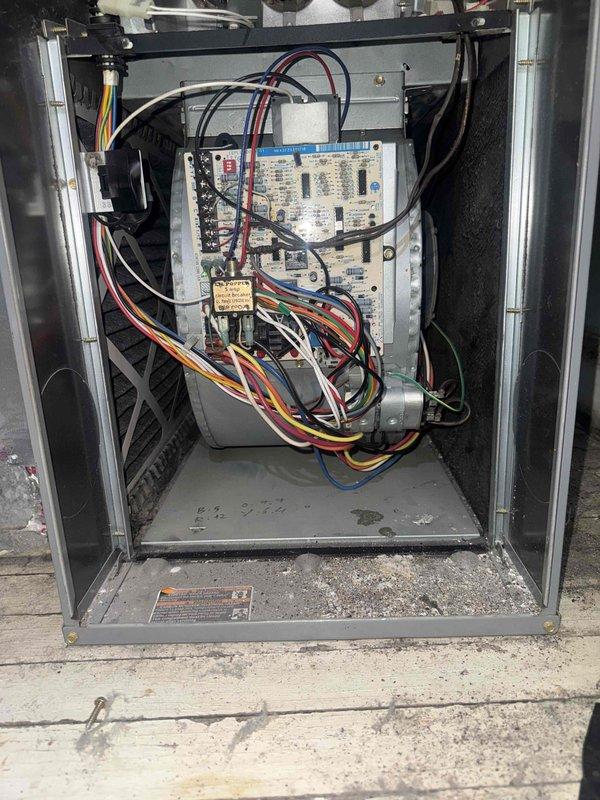 Completed new customer estimate for residential HVAC system located in utility closet. Documented existing equipment with photographs showing furnace unit with gray metal casing, overhead air handler with ductwork, and refrigerant lines along wall. Inspected control board and internal components, noting normal wear and service condition. Collected payment and entered equipment information into service system.